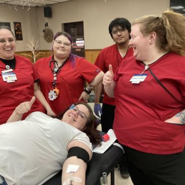 Larissa Furl, one of the many who donated at the event, surrounded by the Red Cross team, Katlyn Stasko, Maria Riccitelli, Jesse Guerrero, and Ariel Rivera.